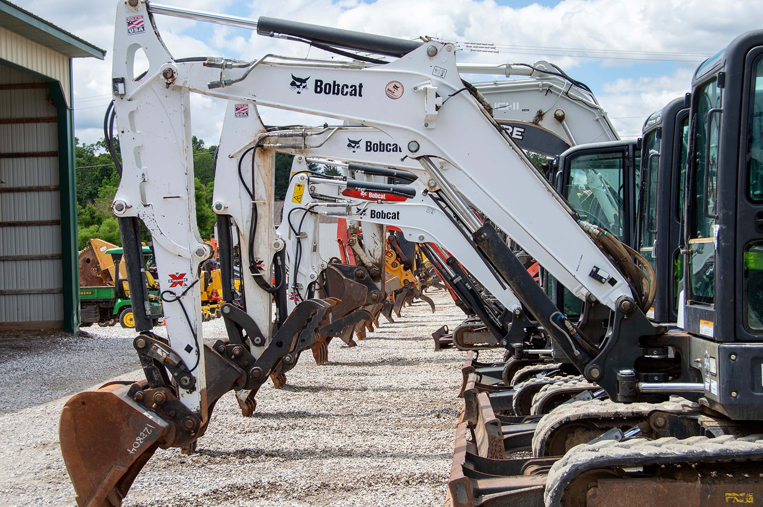 Used Bobcat Excavators Lined Up on Auction Lot